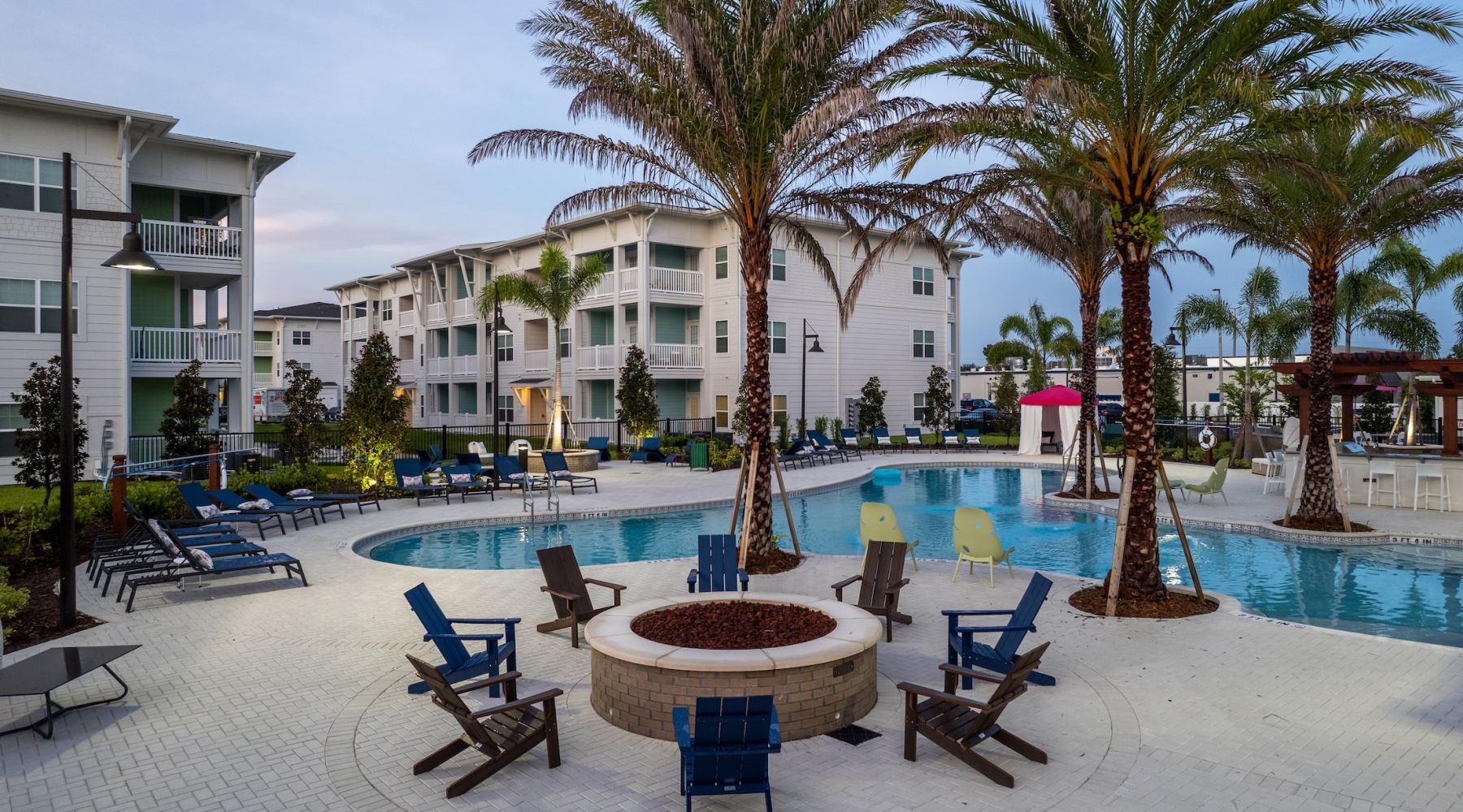 Resort-style swimming pool with lounge seating